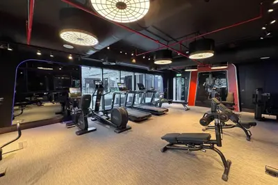 a gym with a bunch of treadms and cardio machines at Frank Porter - J One Tower 2 in Dubai