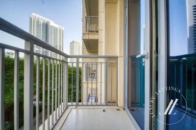 an open balcony with a view of a city at Luxury 2BR Harbour Views Tower 2 Creek Harbour Dubai in Dubai