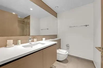 a bathroom with a sink and a toilet at 3 Bedroom in Creek Habour with Scenic Views for Family and Solo Travelers in Dubai