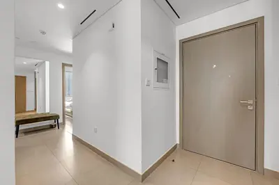 a hallway with a sliding door in a building at 3 Bedroom in Creek Habour with Scenic Views for Family and Solo Travelers in Dubai