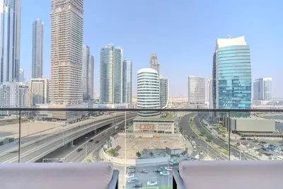 a view of a city skyline with tall buildings at TRPS - MAG 318, Business Bay - Pool View, 2BR Fully Furnished, Prime Location in Dubai