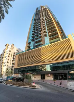 a large tall building with a road in front of it at Samaya Holiday Homes - Square 1B Duplex Panoramic View in Dubai