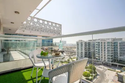 a balcony with a table and chairs in a building at Frank Porter - Glitz Residence 2 in Dubai