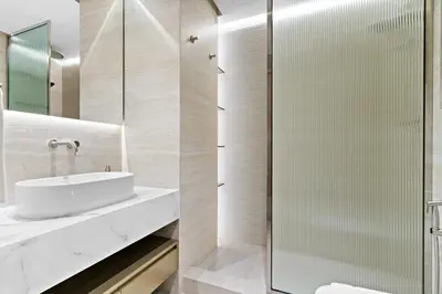 a bathroom with a sink and a shower at The Smart Concierge - Bay Central in Dubai