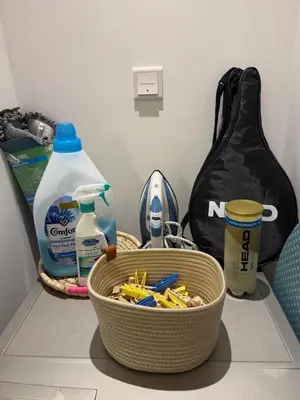 a basket of toothbrushes and other items on a counter at Oakley Square Residence in Dubai