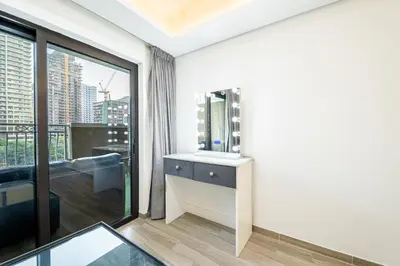 a bathroom with a sink and a mirror at Escape24 Elegant 1BR in JVC with Pool View in Dubai