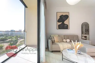 a living room with a couch and a glass table at Beautiful Brand New Spacious in Dubai