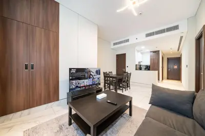 a living room with a couch and a coffee table at Chic and Urban 1-Bed Business Bay Suite in Dubai