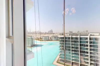 a view of a swimming pool from a building at Vacationer l Stunning 1 Bed l Private Beach l near Downtown in Dubai