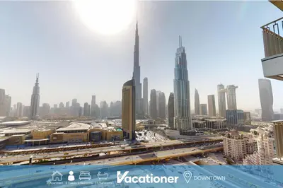 a view of the dubai city from a skyscraper at Vacationer I Luxury 3 Bedroom Apartment I Iconic Burj Khalifa View I Heart of Downtown in Dubai