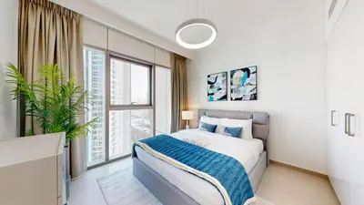 a bedroom with a bed and a large window at Vacationer I Luxury 3 Bedroom Apartment I Iconic Burj Khalifa View I Heart of Downtown in Dubai