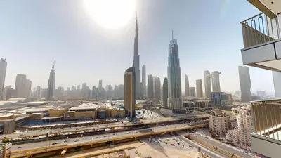 a view of the dubai city from a skyscraper at Vacationer I Luxury 3 Bedroom Apartment I Iconic Burj Khalifa View I Heart of Downtown in Dubai