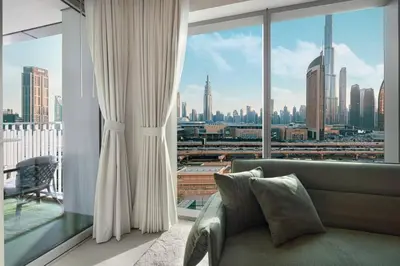 a living room with a view of a city at Luxury 2 bedroom with Burj Khalifa view, connected to Dubai Mall in Dubai