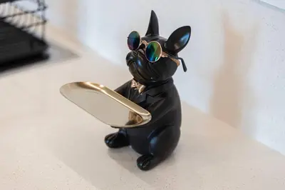 a small figurine of a black cat wearing sunglasses at Luxury 2 bedroom with Burj Khalifa view, connected to Dubai Mall in Dubai