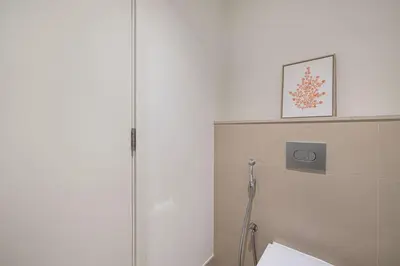 a bathroom with a shower stall and a toilet at Luxury 2 bedroom with Burj Khalifa view, connected to Dubai Mall in Dubai