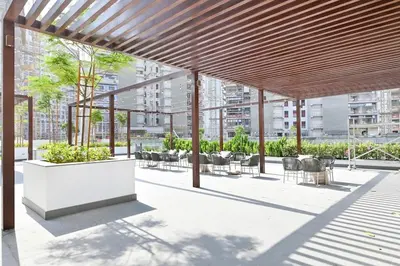a pavilion with tables and chairs in a building at Apartamento Dune en Dubái por beBalmy in Dubai