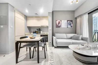 a living room with a couch and a table at Stylish & Elegant Stay Prime Business Bay Spot in Dubai