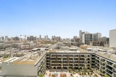an aerial view of a city with buildings at VayK - Gorgeous 1BR Retreat in Binghatti Corner in Dubai