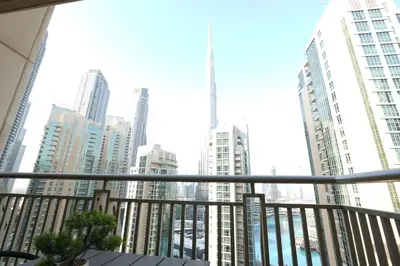 a view of a city from a balcony at Luxury Family Friendly Apartment - Full Burj Khalifa & Fountain Views in Dubai