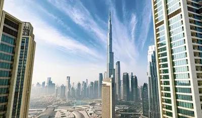 a view of a city with a tall skyscraper at WonderfulStay At Downtown Views II - Best Burj Khalifa View - Direct Dubai Mall Access - Brand New Luxury Apartments in Dubai