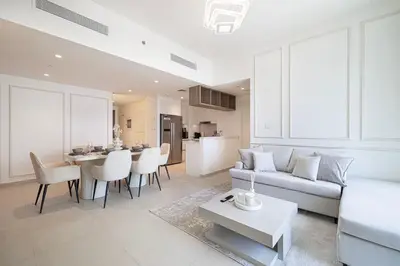 a living room with a couch and a table at WonderfulStay At Downtown Views II - Best Burj Khalifa View - Direct Dubai Mall Access - Brand New Luxury Apartments in Dubai