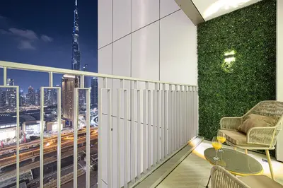a balcony with a view of a city skyline at WonderfulStay At Downtown Views II - Best Burj Khalifa View - Direct Dubai Mall Access - Brand New Luxury Apartments in Dubai