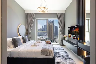a bedroom with a large bed and a large window at WonderfulStay At Downtown Views II - Best Burj Khalifa View - Direct Dubai Mall Access - Brand New Luxury Apartments in Dubai