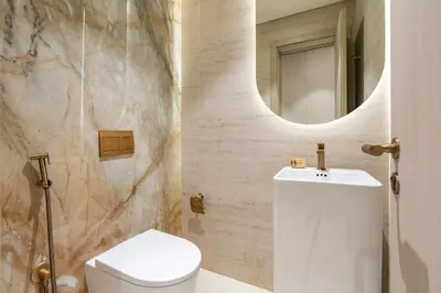 a bathroom with a white toilet and a mirror at PVH - Sleek 1BR near Community Park - Pearl House 1 in Dubai