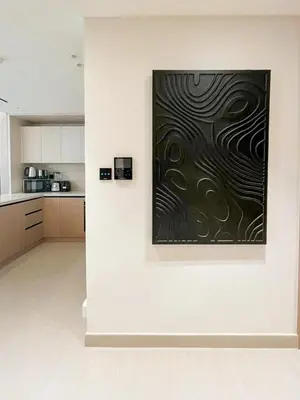 a large painting on a wall in a kitchen at Contemporary Luxe Stay at Dawn by Binghatti! in Dubai