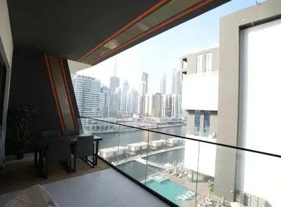 a balcony with a view of a city skyline at Flat in Downtown, Pool & Canal view in Dubai