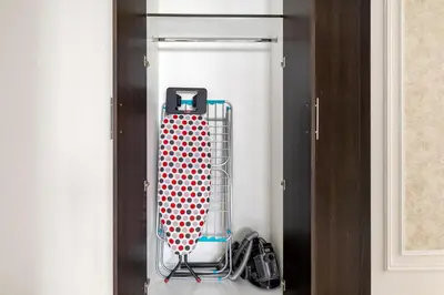 a luggage rack in a closet with a red and white hearts at Spacious 3BR with Gym & Pool in Royal Residences in Dubai