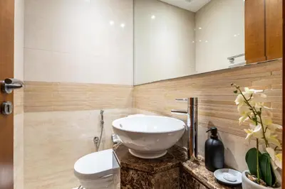 a bathroom with a sink and a toilet at GuestReady - 2BR l Stunning Marina Views in Dubai