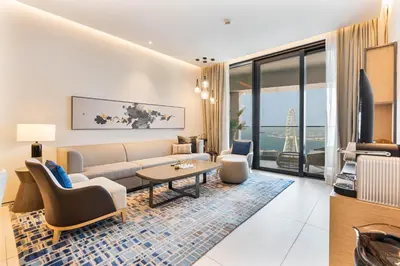 a living room with a couch and a table at Luxury 3 bedroom Apartment Full Sea & Ain Dubai View Address JBR in Dubai