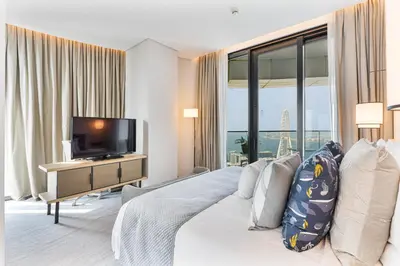 a bedroom with a large bed and a television at Luxury 3 bedroom Apartment Full Sea & Ain Dubai View Address JBR in Dubai