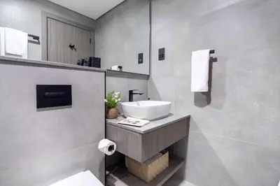 a bathroom with a sink and a mirror at Frank Porter - Al Serh Residences 11 in Dubai