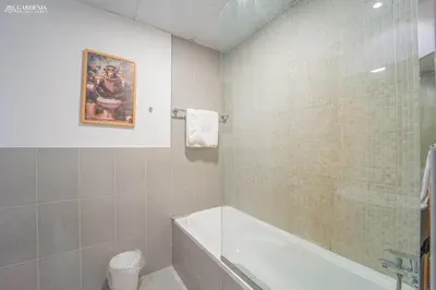 a bathroom with a bath tub and a sink at Peaceful Apartment - Cozy Interiors - 1BR in JVC in Dubai