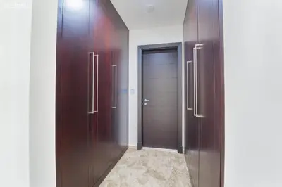 a hallway with two wooden doors in a room at Elite Villa in Jumeirah Park - Private Pool - 4BR in Dubai