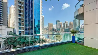 a balcony with a view of the city at Chic waterfront 1 bedroom apartment, walk to beach, promenade, metro in Dubai