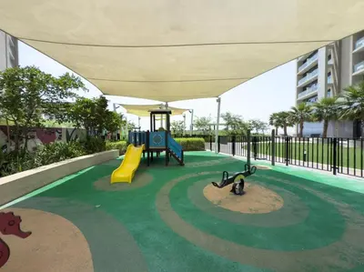 a playground with a slide in a building at GuestReady - 2BR l City Chic in the Sky in Dubai