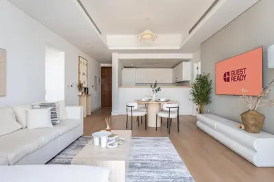 a living room with a couch and a table at GuestReady - Lux Apt Downtown | Near Dubai Mall in Dubai