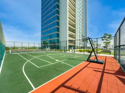 an empty tennis court in a building at Downtown with Direct Access Dubai Mall & Burj Khalifa in Dubai