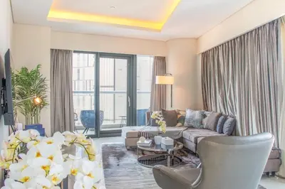 a living room with a couch and a table at 2BR - DAMAC Towers by Paramount - Business Bay in Dubai