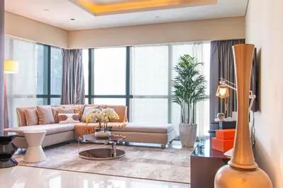 a living room with a couch and a table at Old Hollywood Glamour by Namuve - Damac Paramount in Dubai
