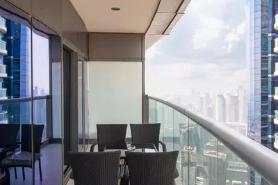 a dining room with a view of a city at Old Hollywood Glamour by Namuve - Damac Paramount in Dubai