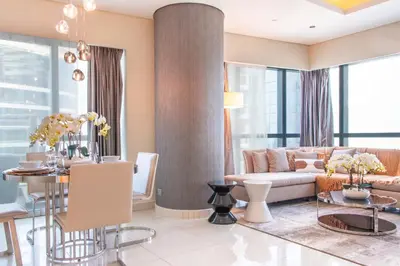 a living room with a couch and a table at Old Hollywood Glamour by Namuve - Damac Paramount in Dubai