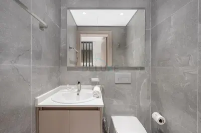a bathroom with a sink and a mirror at Minutes from Dubai Marina with Easy Access to Sheikh Mohammed Bin Zayed Road - Cloud Tower A, Jumeirah Village Triangle by Deluxe Holiday Homes in Dubai