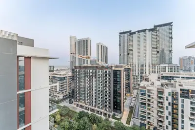 a view of a city skyline with tall buildings at Furnished Balcony with Creek Views, Near Ras Al Khor Wildlife Sanctuary and Downtown Dubai - Wilton Park Residences 1, Sobha Hartland by Deluxe Holiday Homes in Dubai