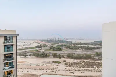 a view of a city from a building at Furnished Balcony with Creek Views, Near Ras Al Khor Wildlife Sanctuary and Downtown Dubai - Wilton Park Residences 1, Sobha Hartland by Deluxe Holiday Homes in Dubai