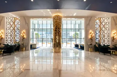 a lobby with a large column in the middle of a building at Contemporary Studio in Business Bay - Burj Khalifa View - Gym & Pool in Dubai