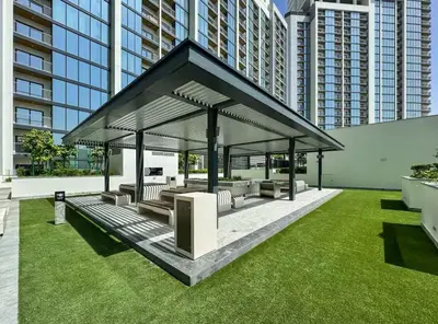 a gazebo in a city with tall buildings at Spacious apartment with Burj Khalifa view close to Dubai mall! in Dubai